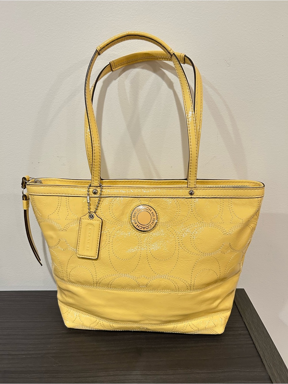 Coach Signature patent leather tote bag in a bright yellow color. EUC